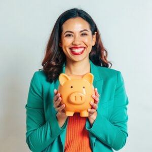 woman-holding-piggy-bank-with-green-jacket